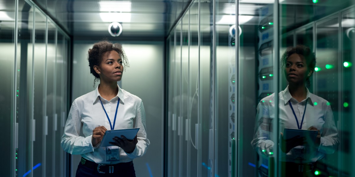 Woman-checking-servers-in-data-center